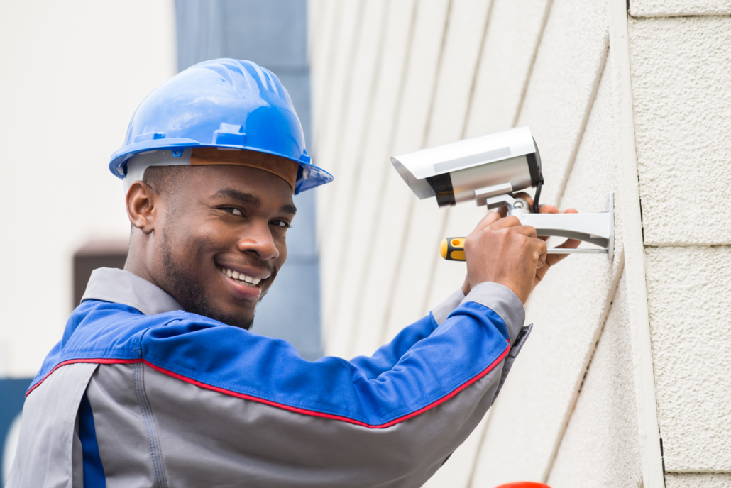 Handyman installing security camera